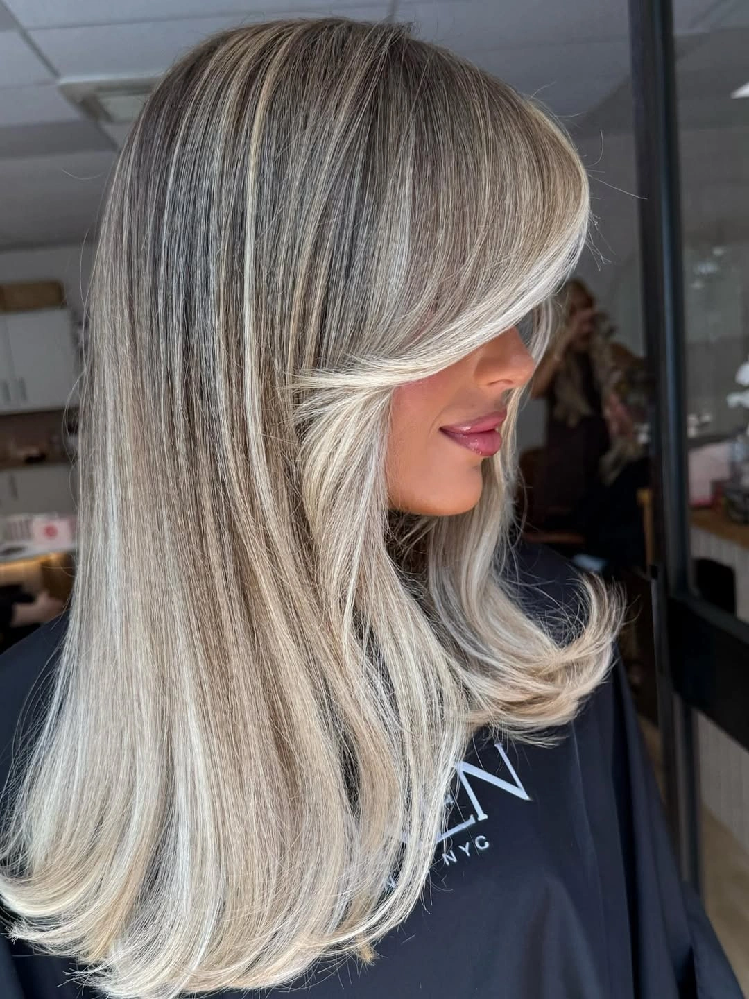 modern hair lowlights: color ideas and inspiration Cool Champagne Layers with Airy Curtain Framing