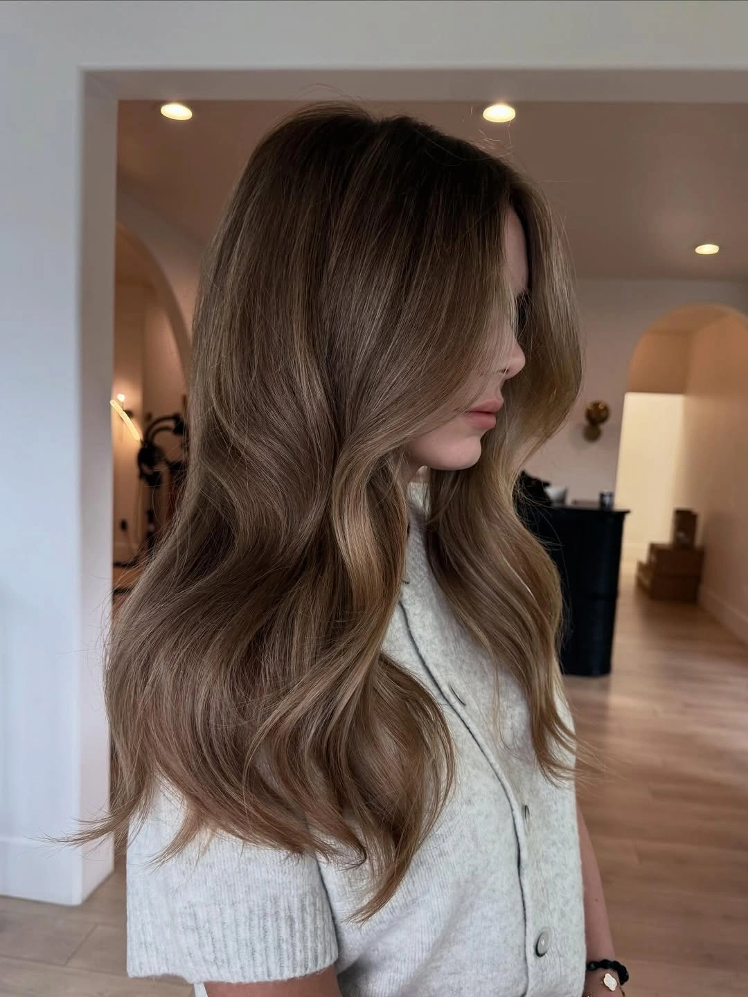 modern hair lowlights: color ideas and inspiration Mocha Melt Lowlights for Effortless Long Waves