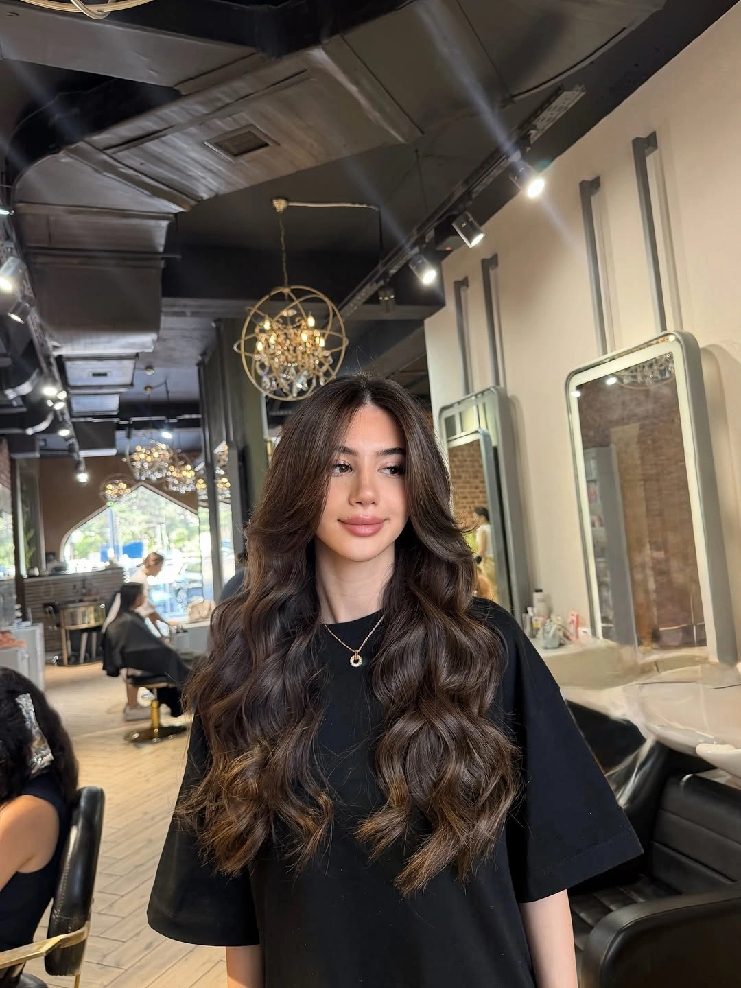 rich fall brunette hair colour 2026 Glossy Espresso Waves With Airy Face-Framing Layers