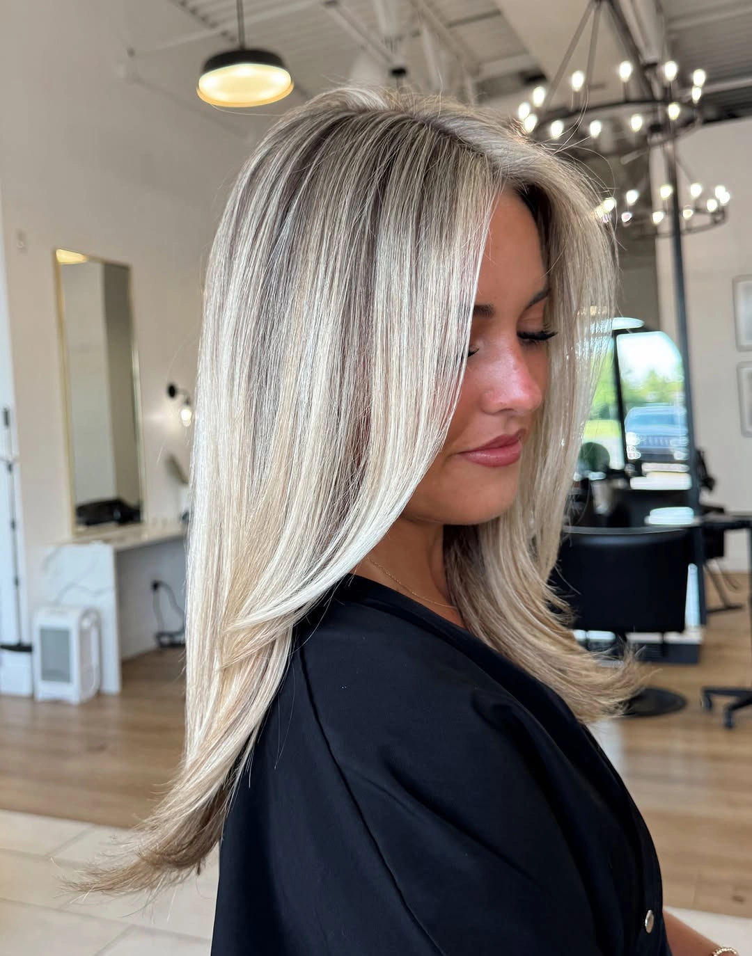 stunning fall blonde hair colour 2026 Silky Vanilla Blonde With Sculpted Curtain Layers