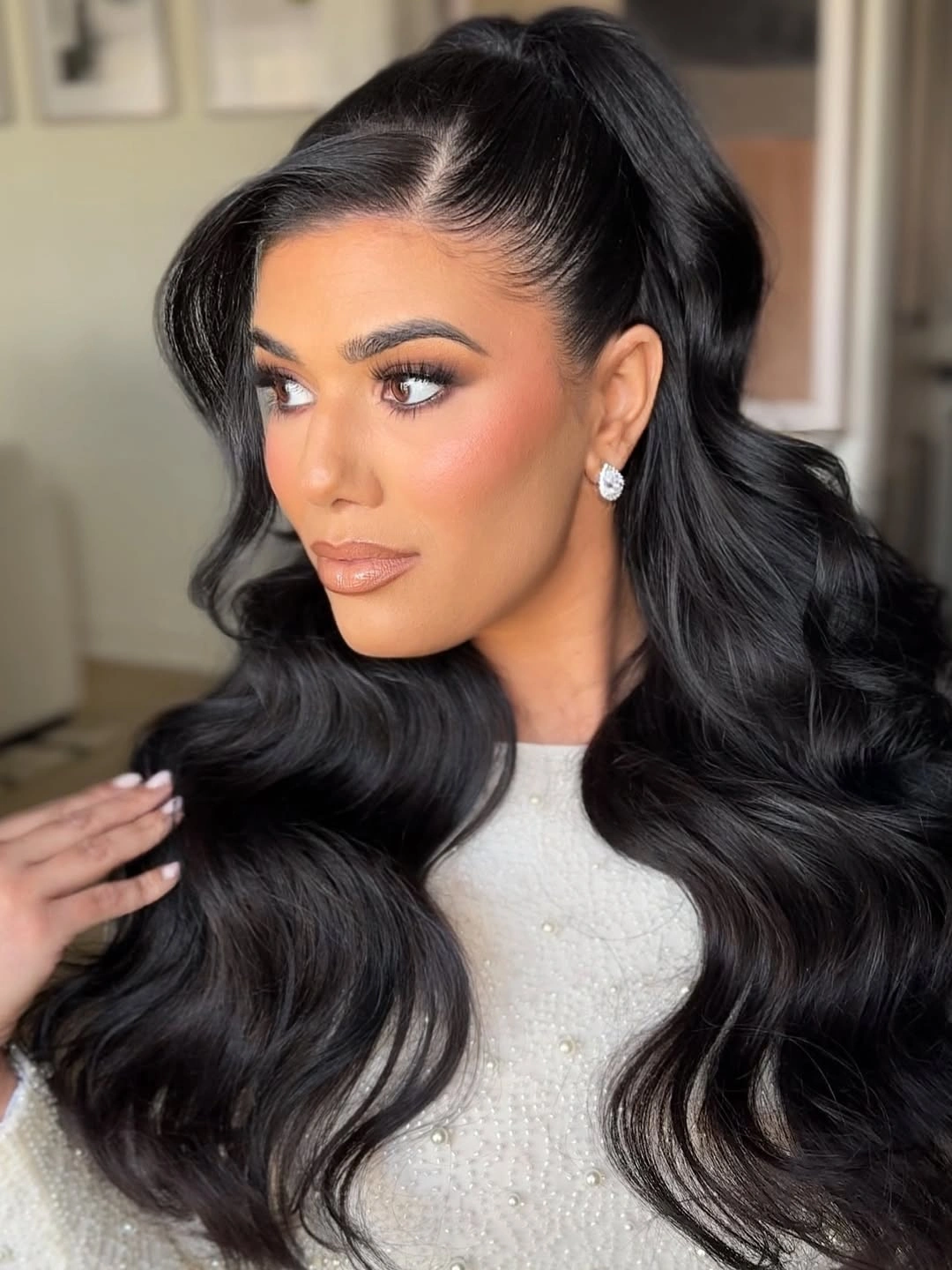 stylish bridesmaid hairstyling Glossy Hollywood Waves with a Modern Ponytail Twist