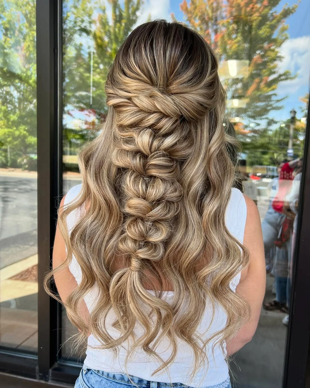 stylish bridesmaid hairstyling Romantic Braided Half Up Waves