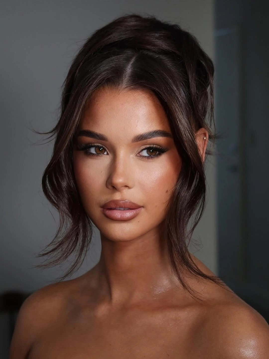 stylish bridesmaid hairstyling Relaxed Textured Updo with Effortless Face-Framing Layers