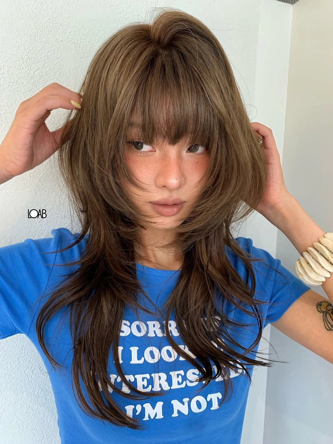 stylish choppy medium layered hair Feathered Espresso Layers with Soft Curtain Fringe