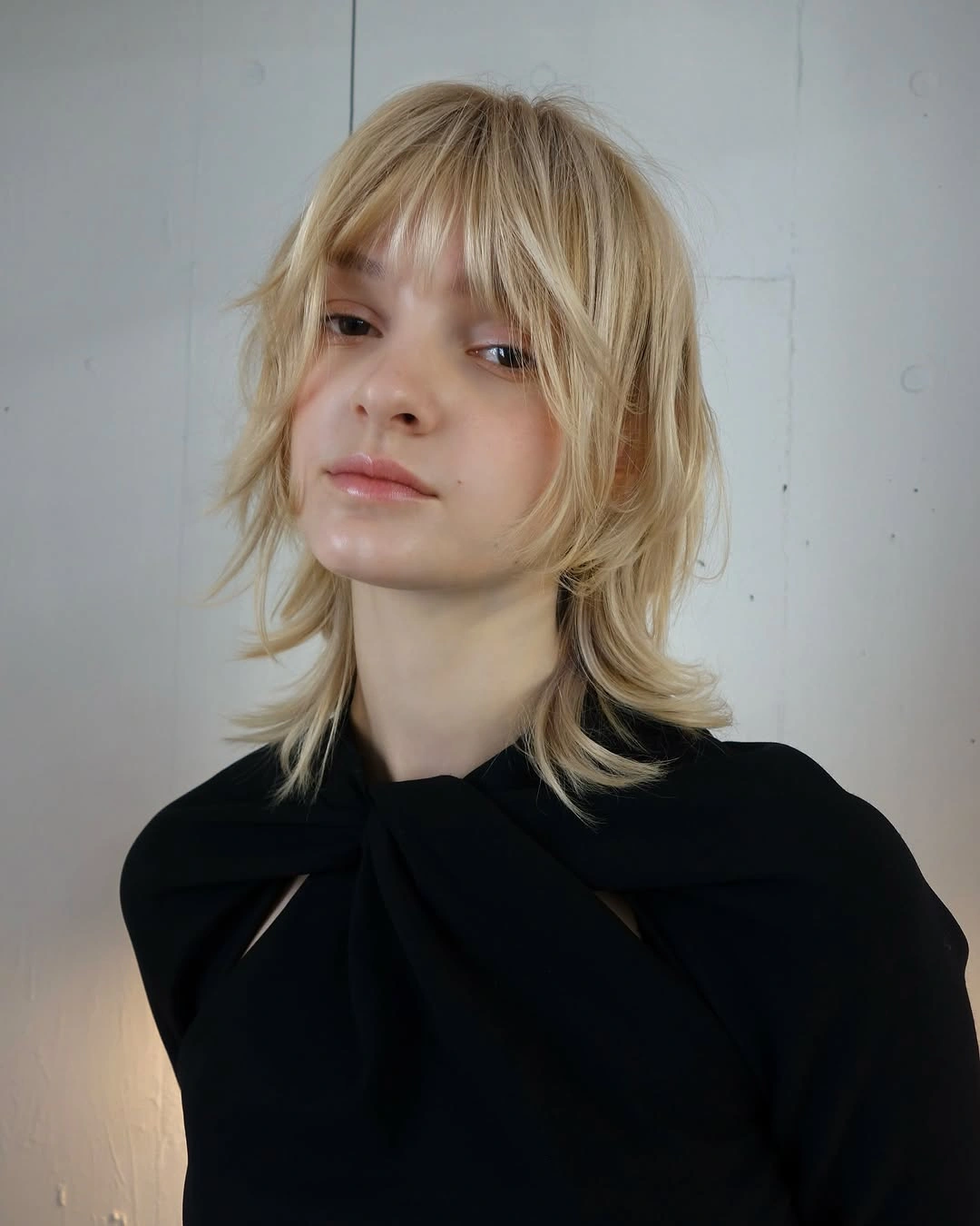 stylish choppy medium layered hair Soft Blonde Shag with Wispy Movement