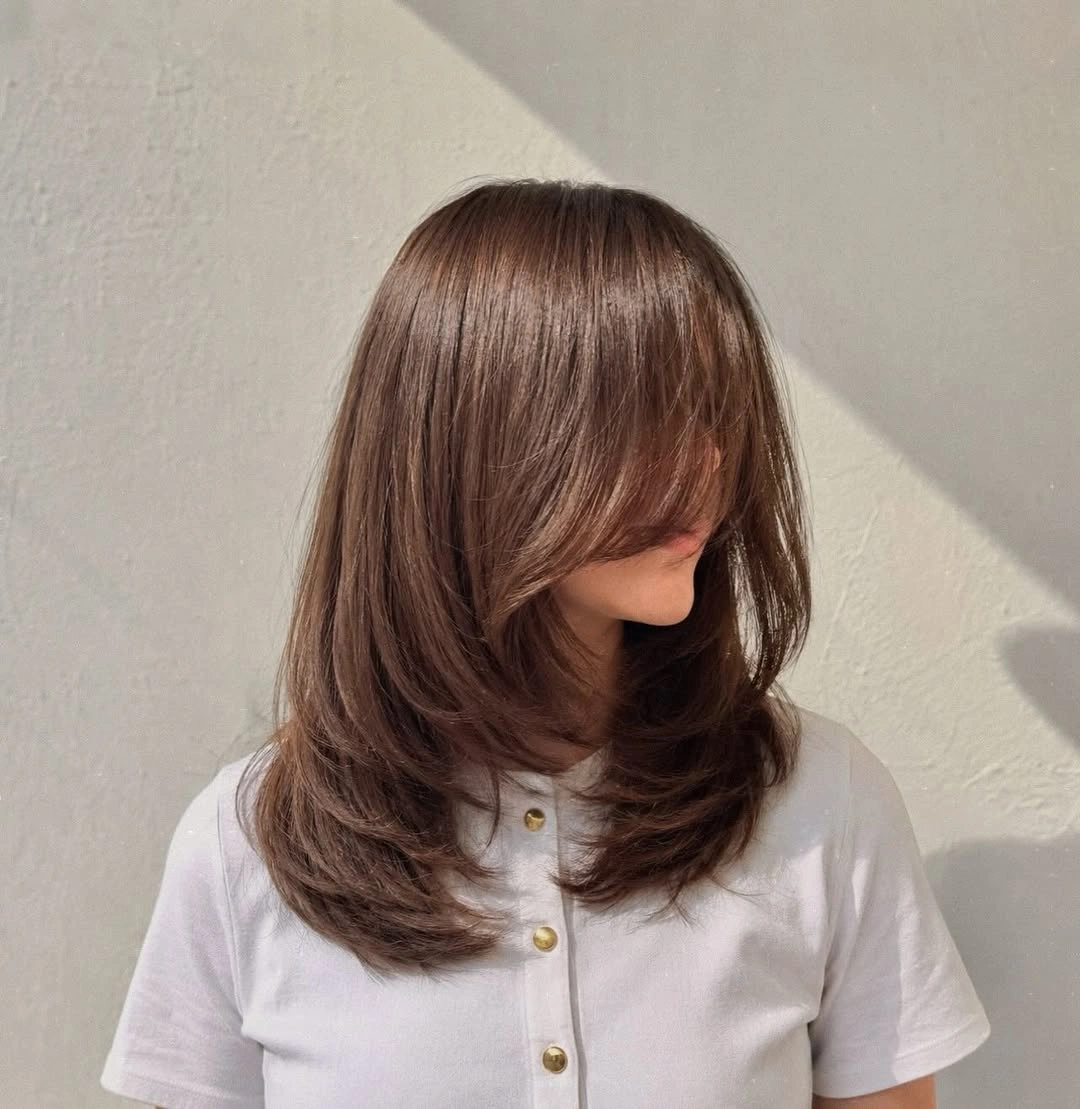 stylish choppy medium layered hair Chocolate Layers With Face-Framing Drama
