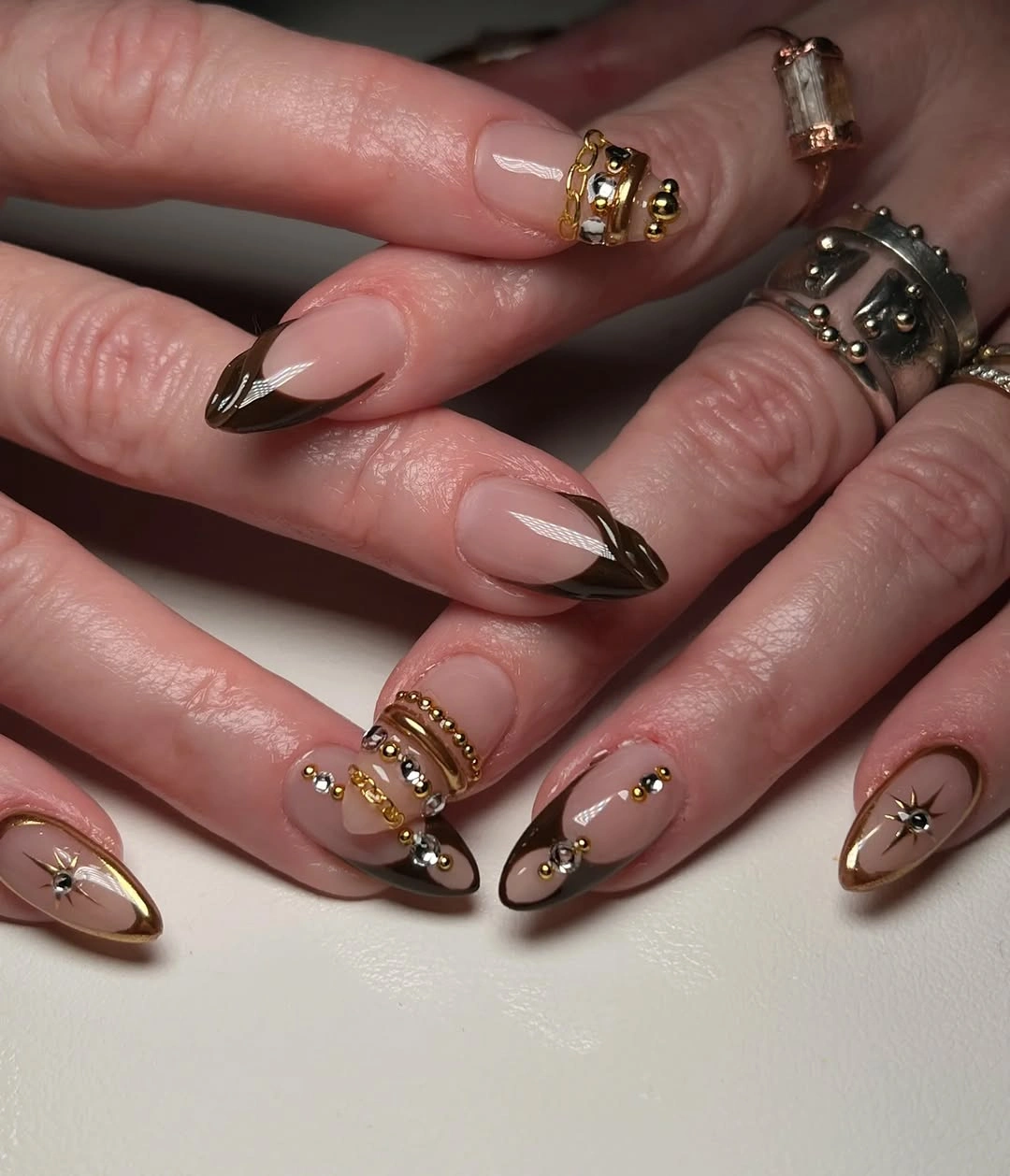 stylish fall medium nail ideas 2026 Modern French Tips With Gold Charms