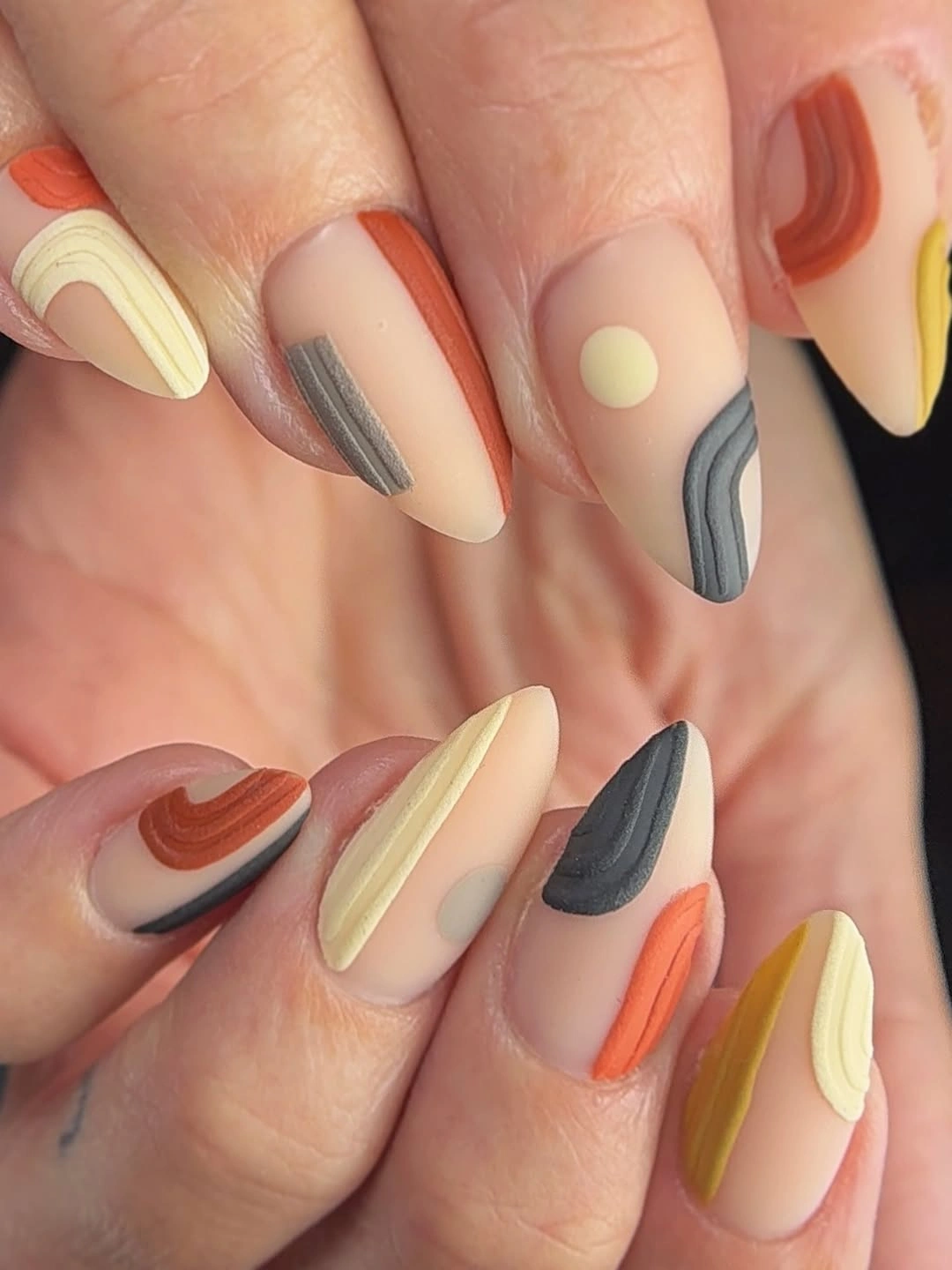 stylish fall medium nail ideas 2026 Abstract Matte Earth Tone Waves