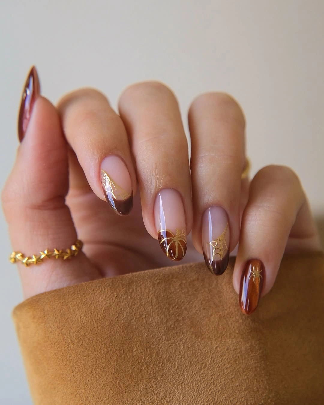 stylish september nail designs 2026 Chocolate French Tips with Golden Halloween Details