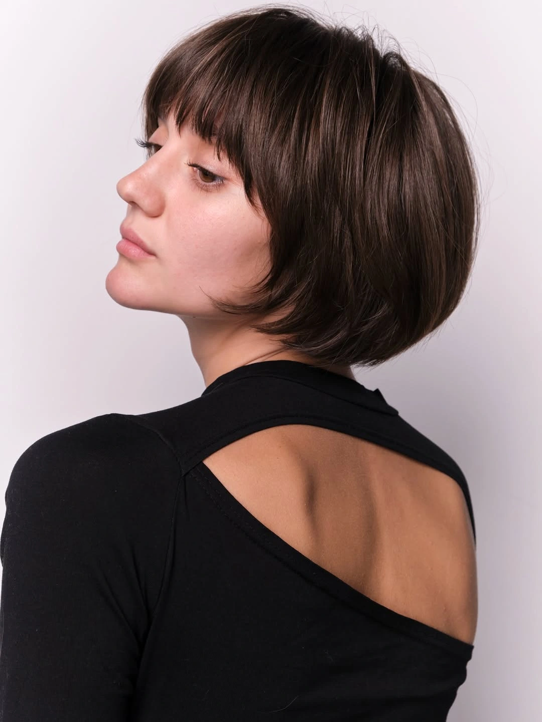 stylish short bobbed hairstyle French-Inspired Bob With Full Fringe And Elegant Volume