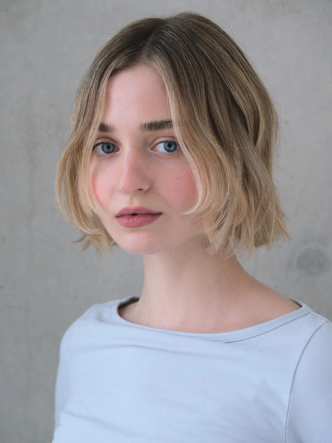 stylish short bobbed hairstyle Airy Center-Part Bob With Face-Framing Layers