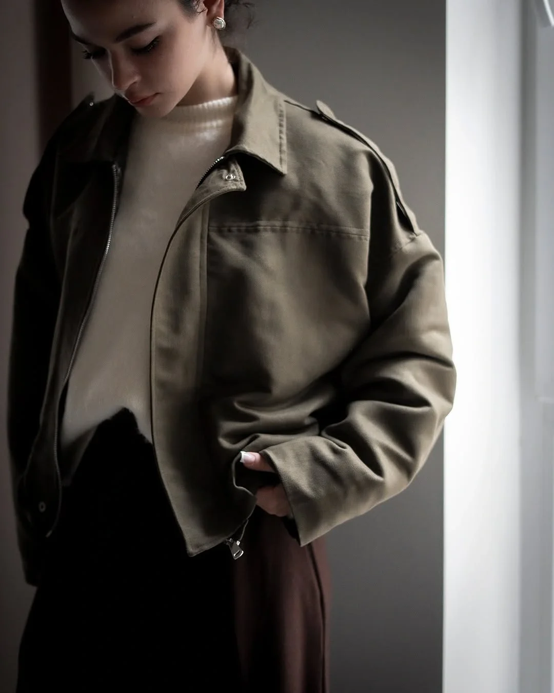 Trench coat fall outfits 2026 The Cropped Olive Jacket That Makes Casual Layers Feel Elevated