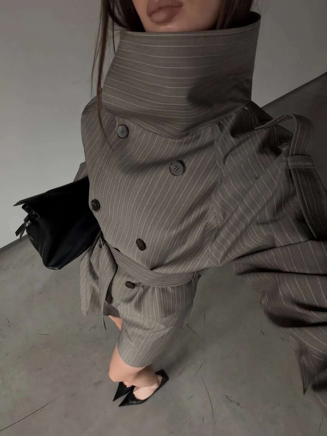 Trench coat fall outfits 2026 A Gray Pinstripe Trench With Tailored Elegance