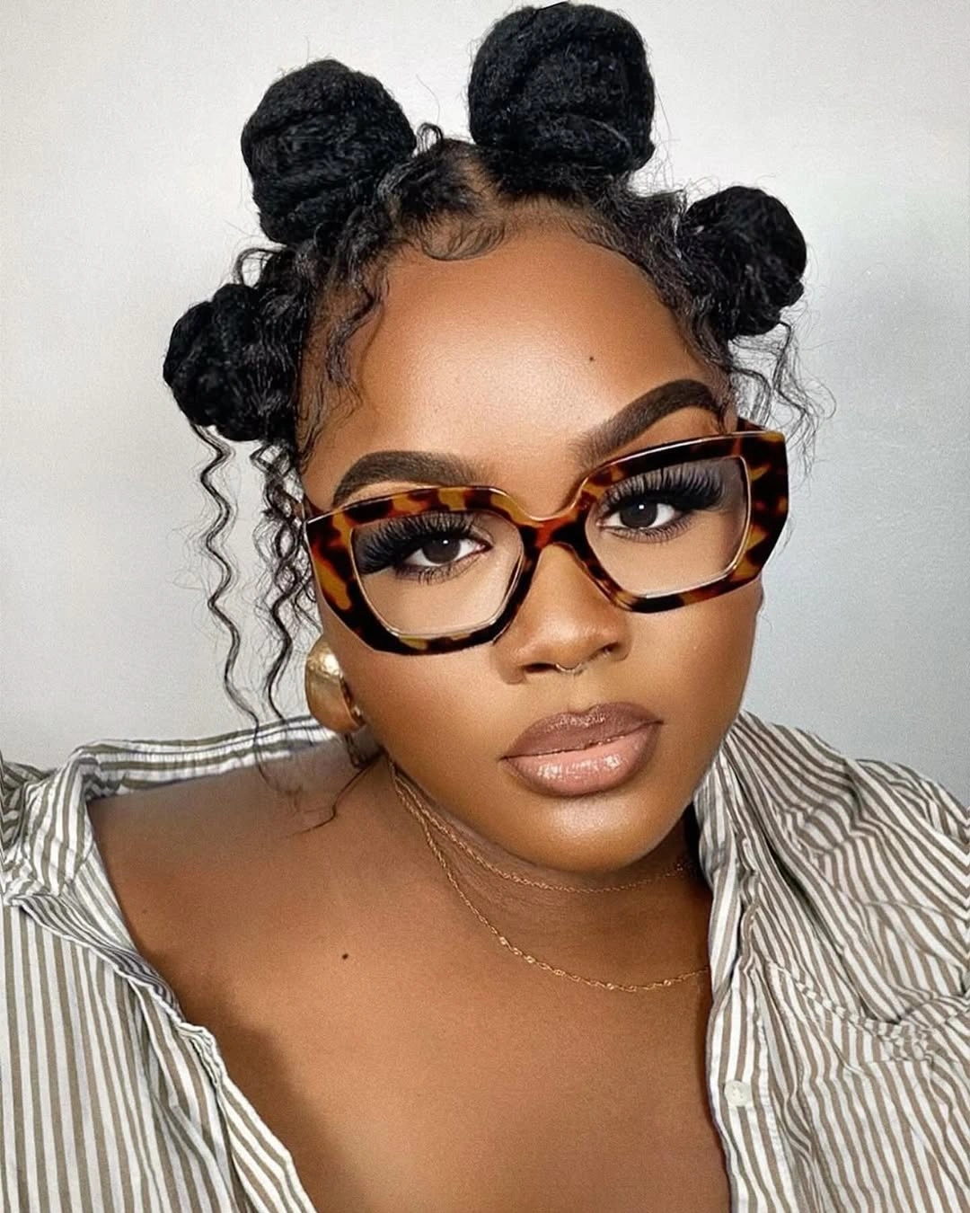 trendy bantu knots hairstyles Soft Sculptural Bantu Knots With Curly Face-Framing Pieces
