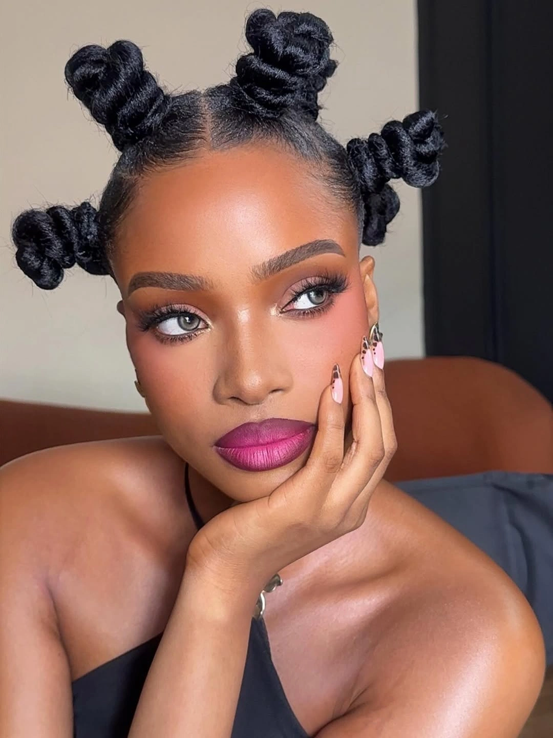 trendy bantu knots hairstyles Playful Sculpted Knots With a Glossy Finish
