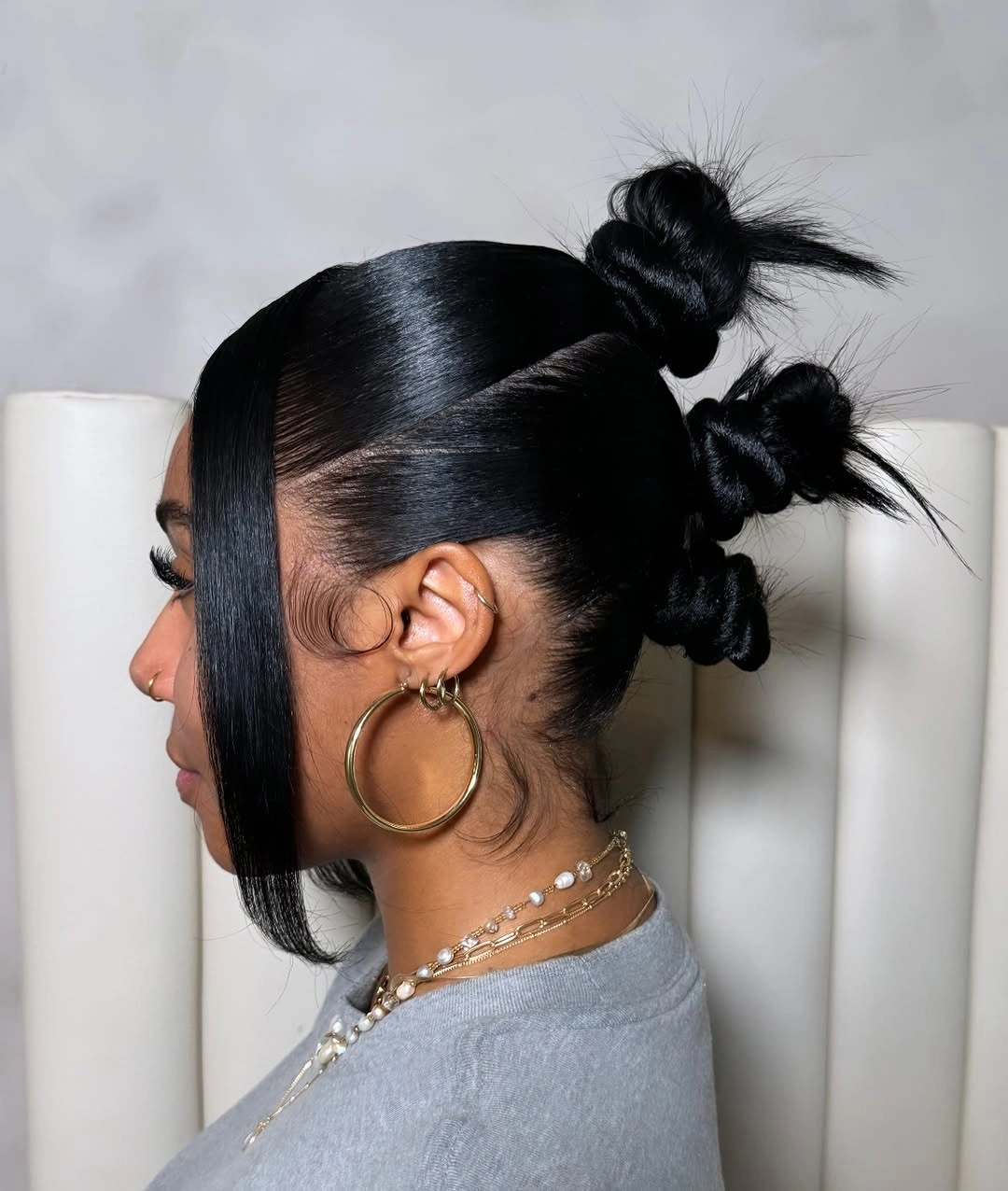 trendy bantu knots hairstyles Sleek Triple Bantu Knots With a Minimalist Finish