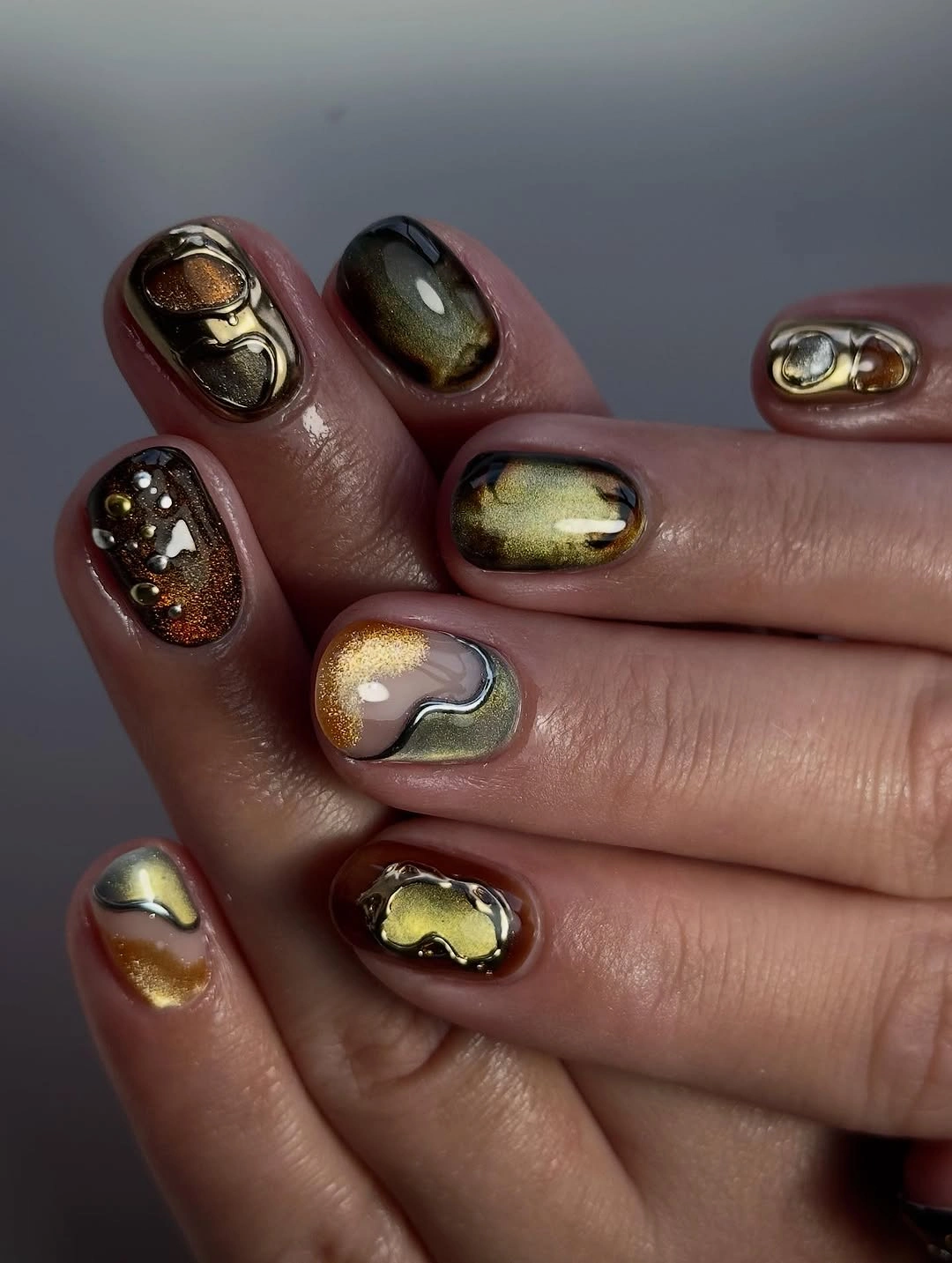 trendy september nails color 2026 Molten Bronze Cat Eye for Moody Fall Evenings