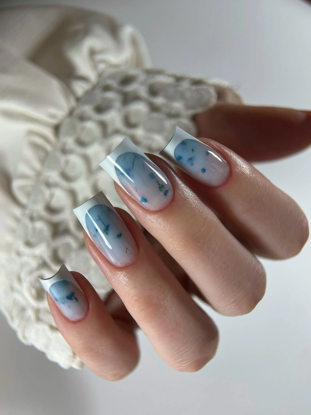 beautiful early fall nails 2026 Milky blue French tips with tiny details