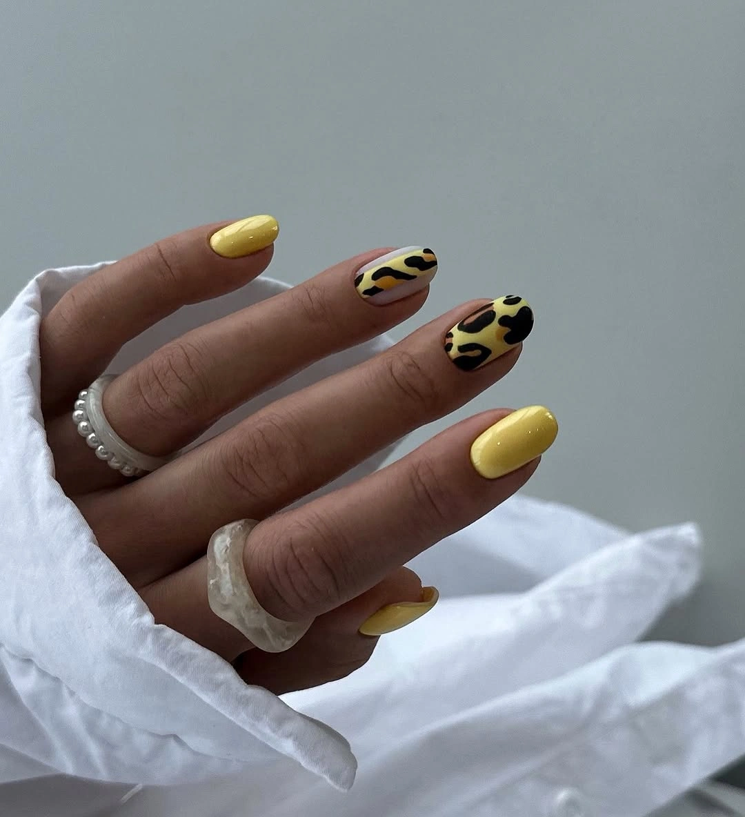 beautiful early fall nails 2026 yellow nails with leopard nail art