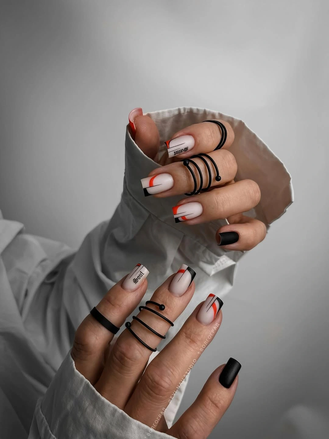 beautiful early fall nails 2026 black white and red graphic square nails