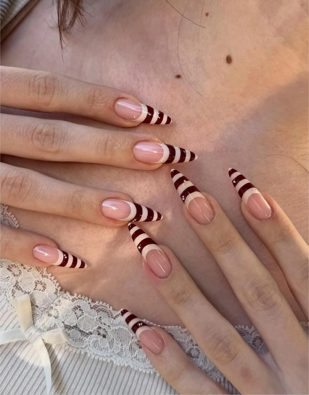 beautiful fall long nails 2026 burgundy cream striped stiletto nails