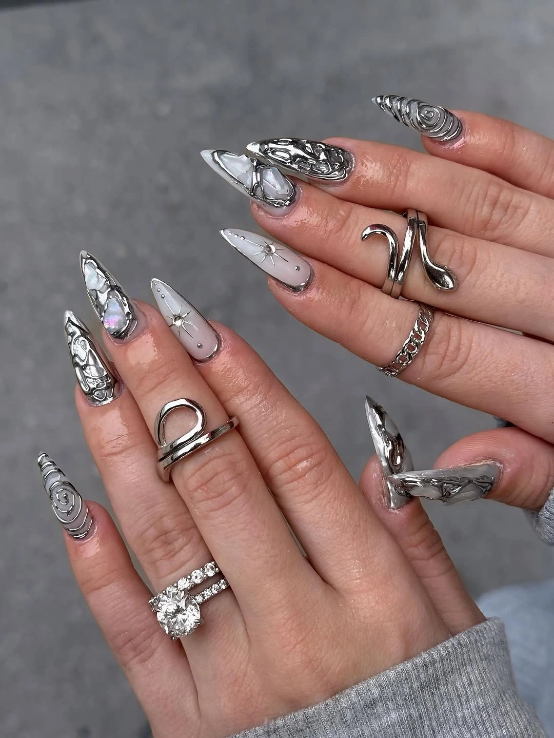 beautiful fall long nails 2026 silver sculptural stiletto nails