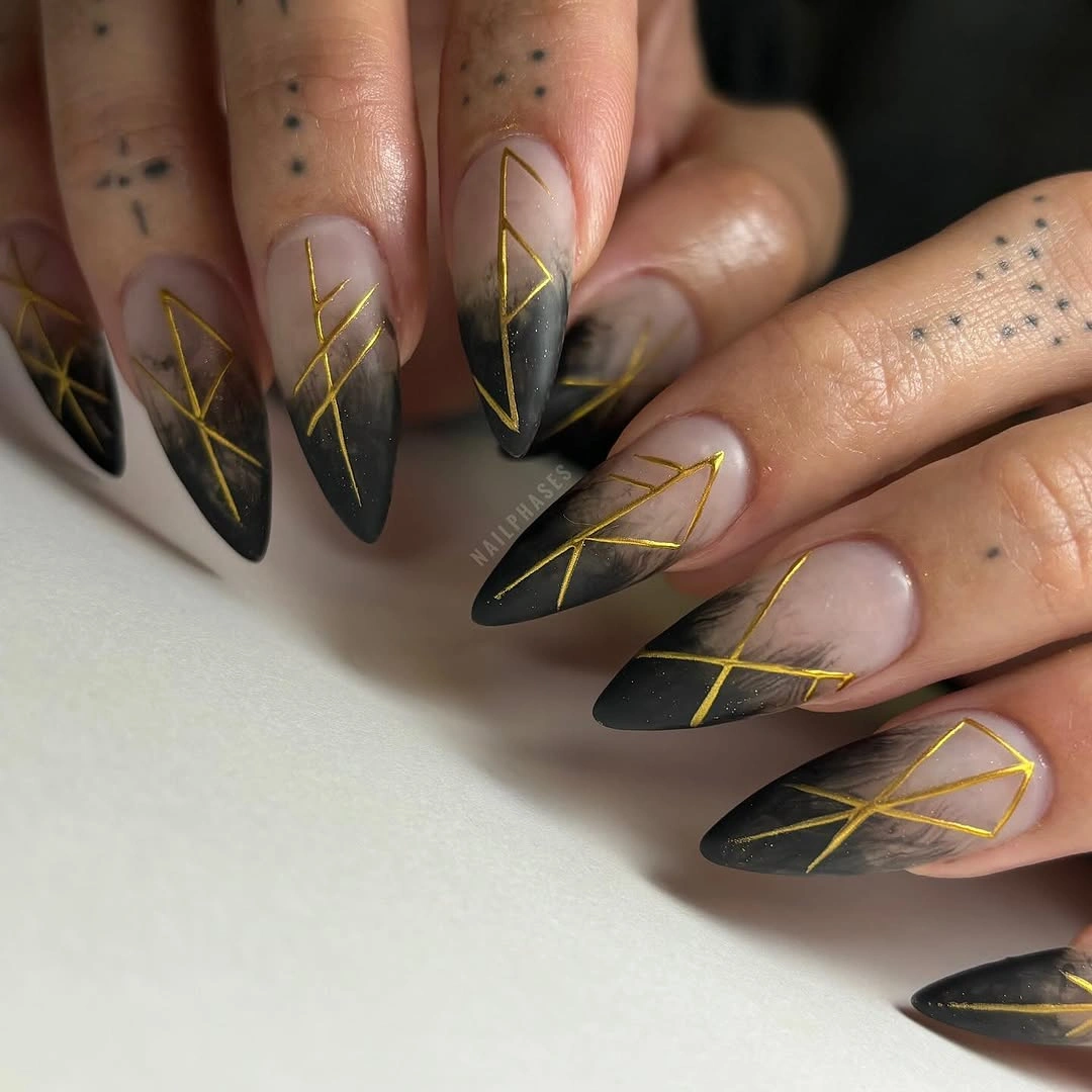 beautiful fall nail art ideas 2026 Black and Gold Geometric Almond Nails