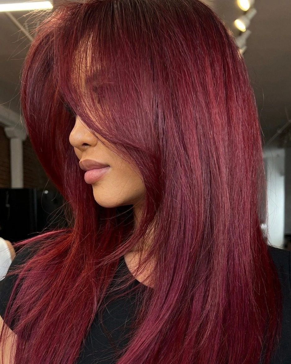 beautiful september hair colour trends 2026 Rich Burgundy With Long Feathered Layers