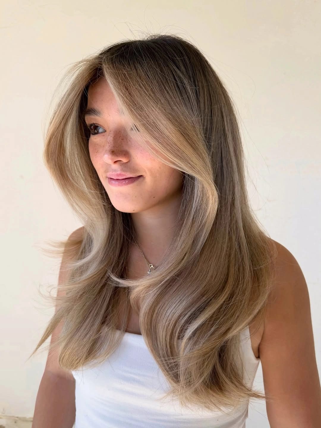 beautiful september hair colour trends 2026 Soft Mushroom Bronde With Face Framing Layers
