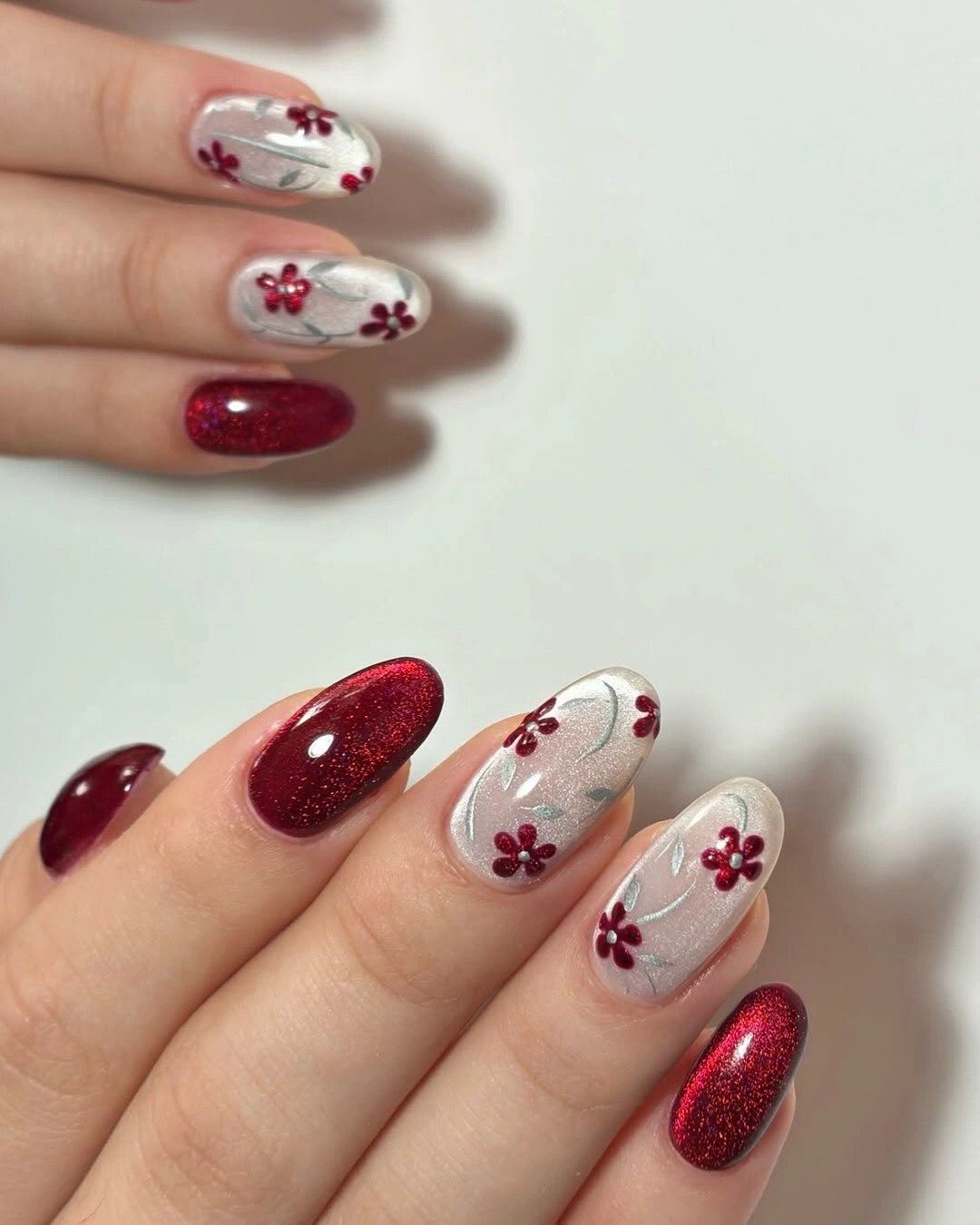 chic fall burgundy nails with design - Cherry Burgundy and Silver Floral Nail Art