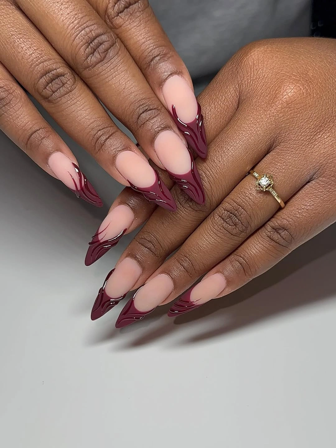 chic fall burgundy nails with design - Nude Almond Nails With Sculpted Burgundy Tips