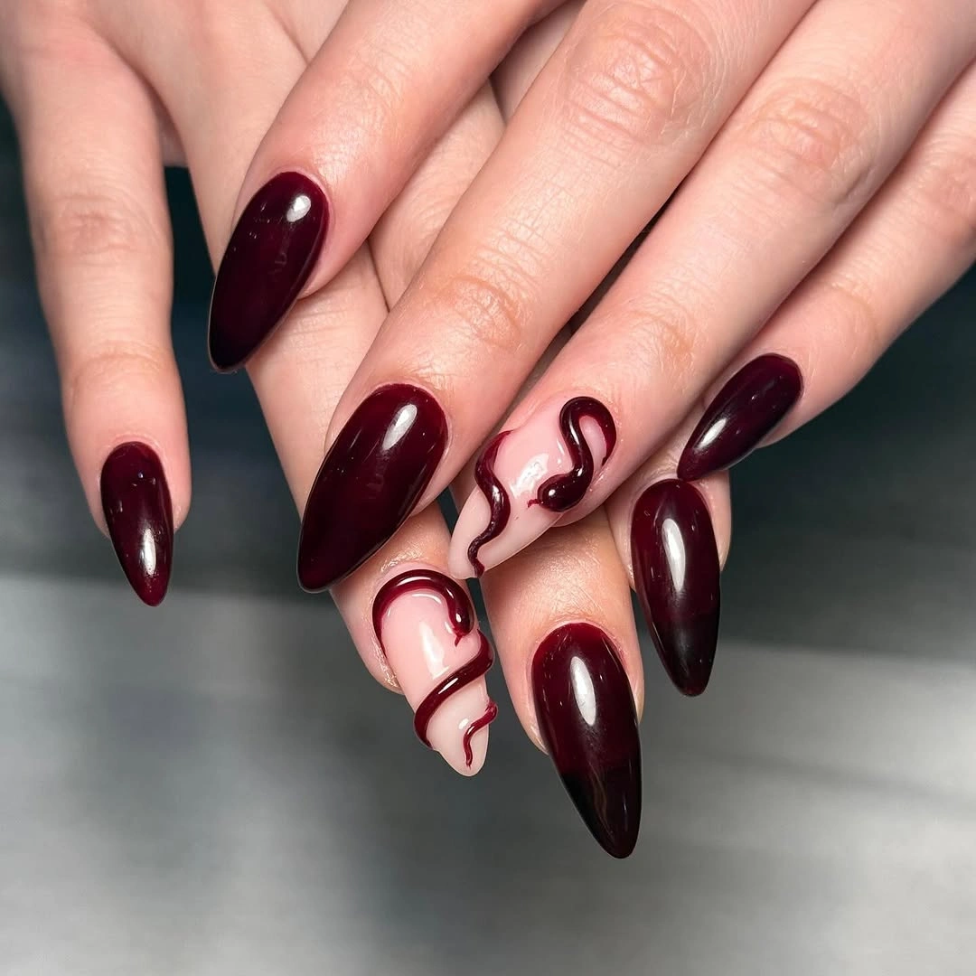 chic fall burgundy nails with design Deep Burgundy Almond Nails With Abstract Pink Waves