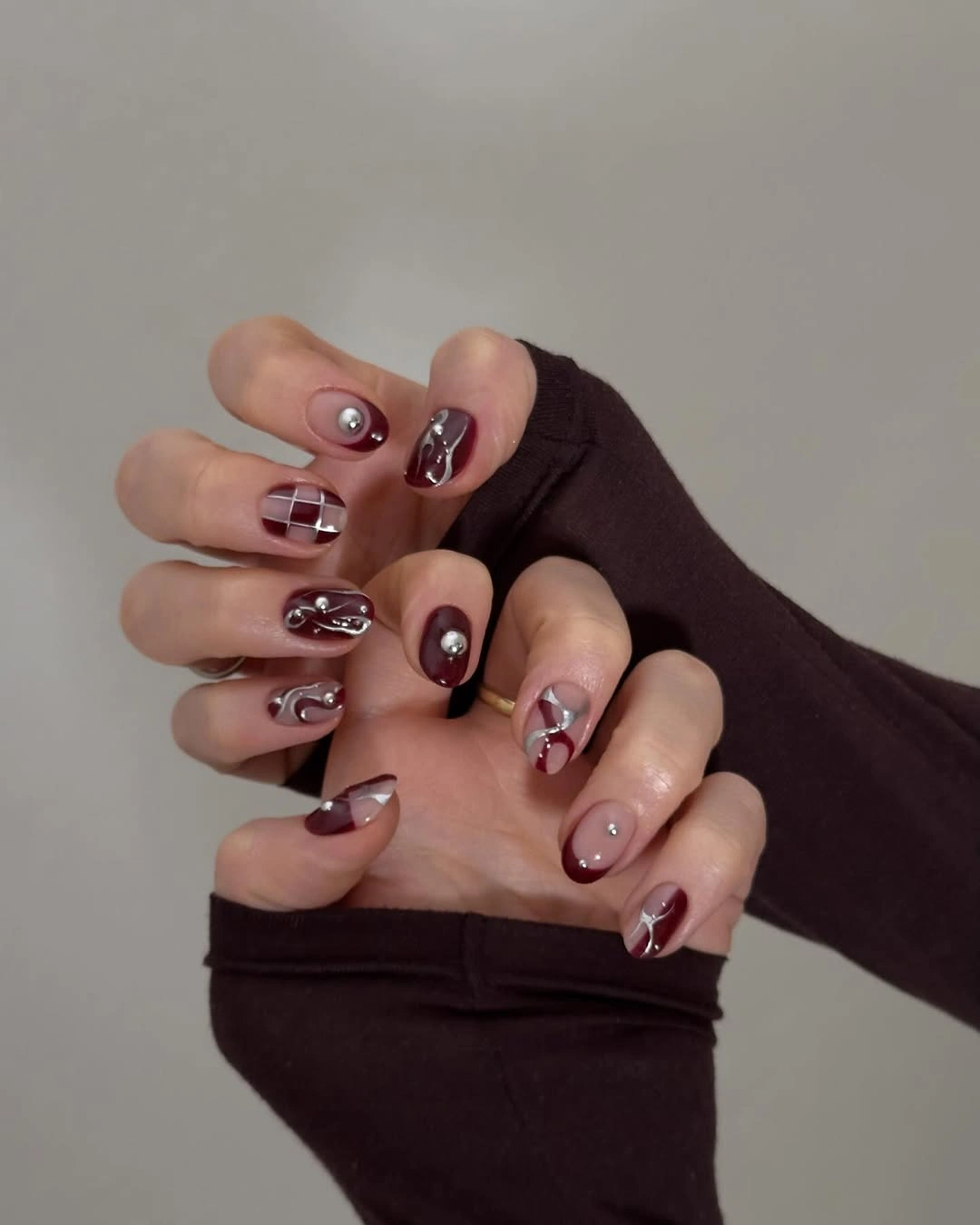chic fall burgundy nails with design Short Burgundy Nails With Silver 3D Details
