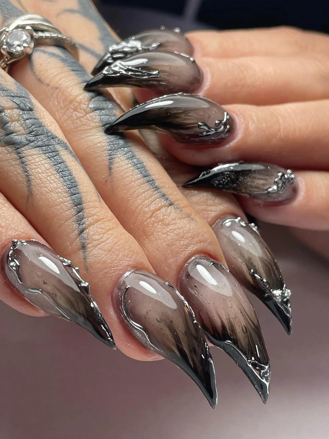 chic fall dark nail shadow ideas 2026 - Smoky Silver Black Almond Nails