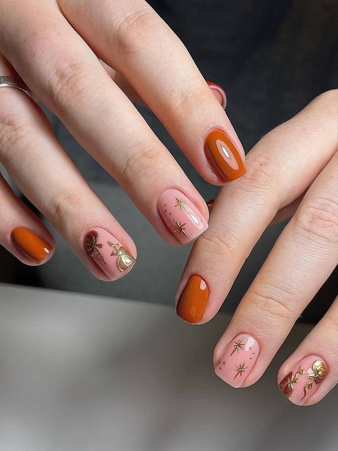 chic fall dark nail shadow ideas 2026 - Burnt Orange, Sheer Pink and Golden Autumn Charms