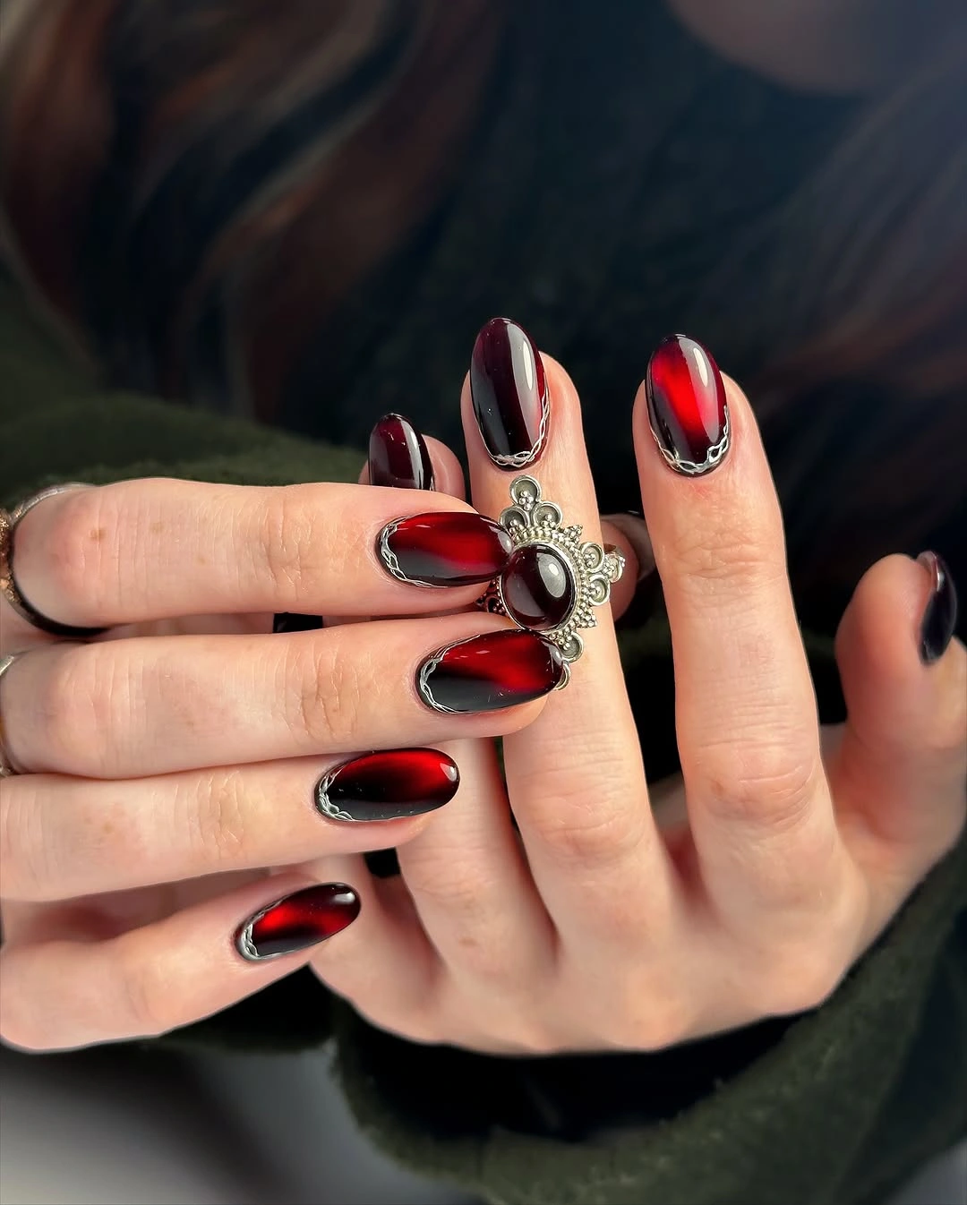 chic fall dark nail shadow ideas 2026 - Black Cherry Cat Eye With Silver Chain Framing