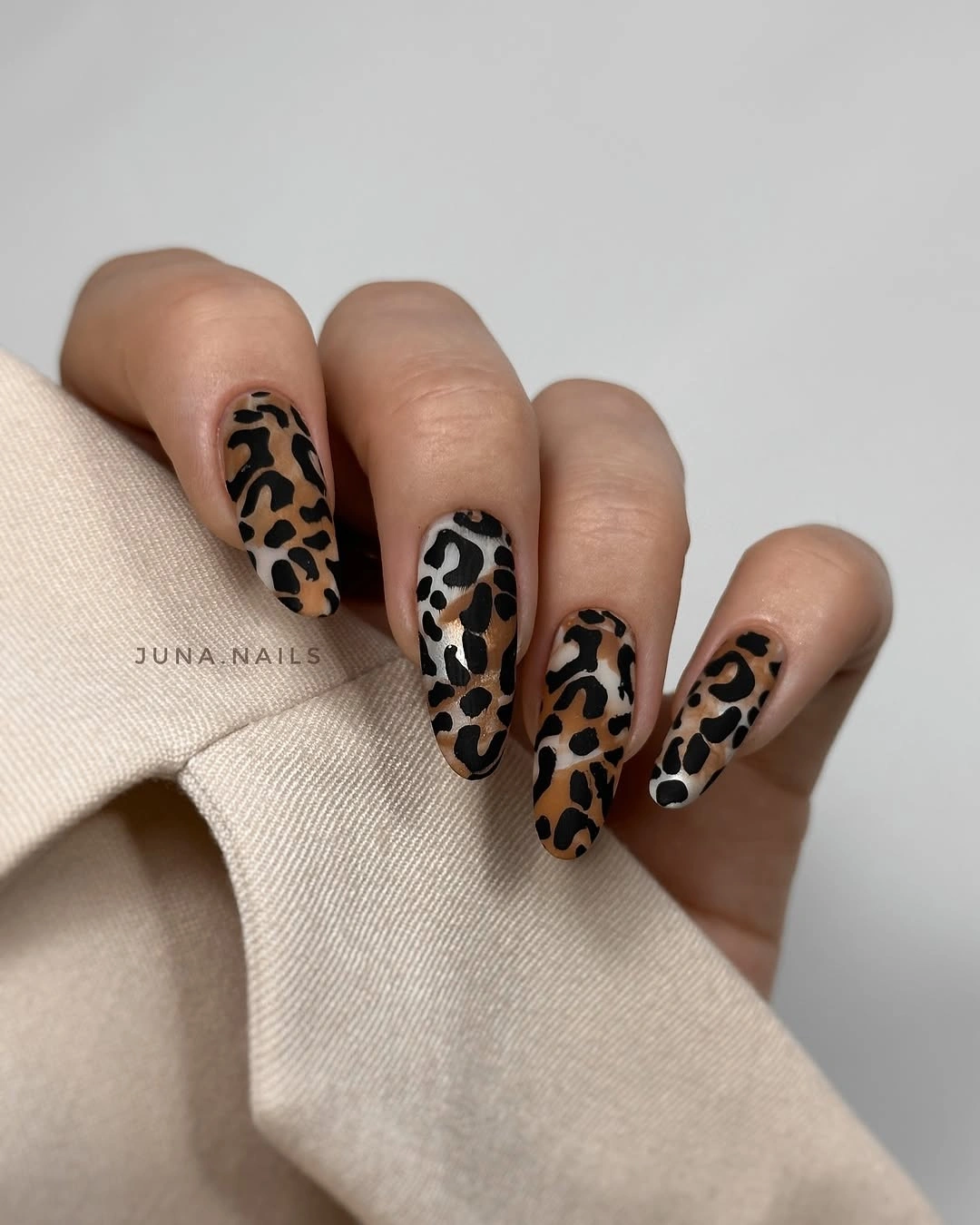 chic fall gel nails ideas 2026 - Long Leopard Gel Nails With a Warm Autumn Finish