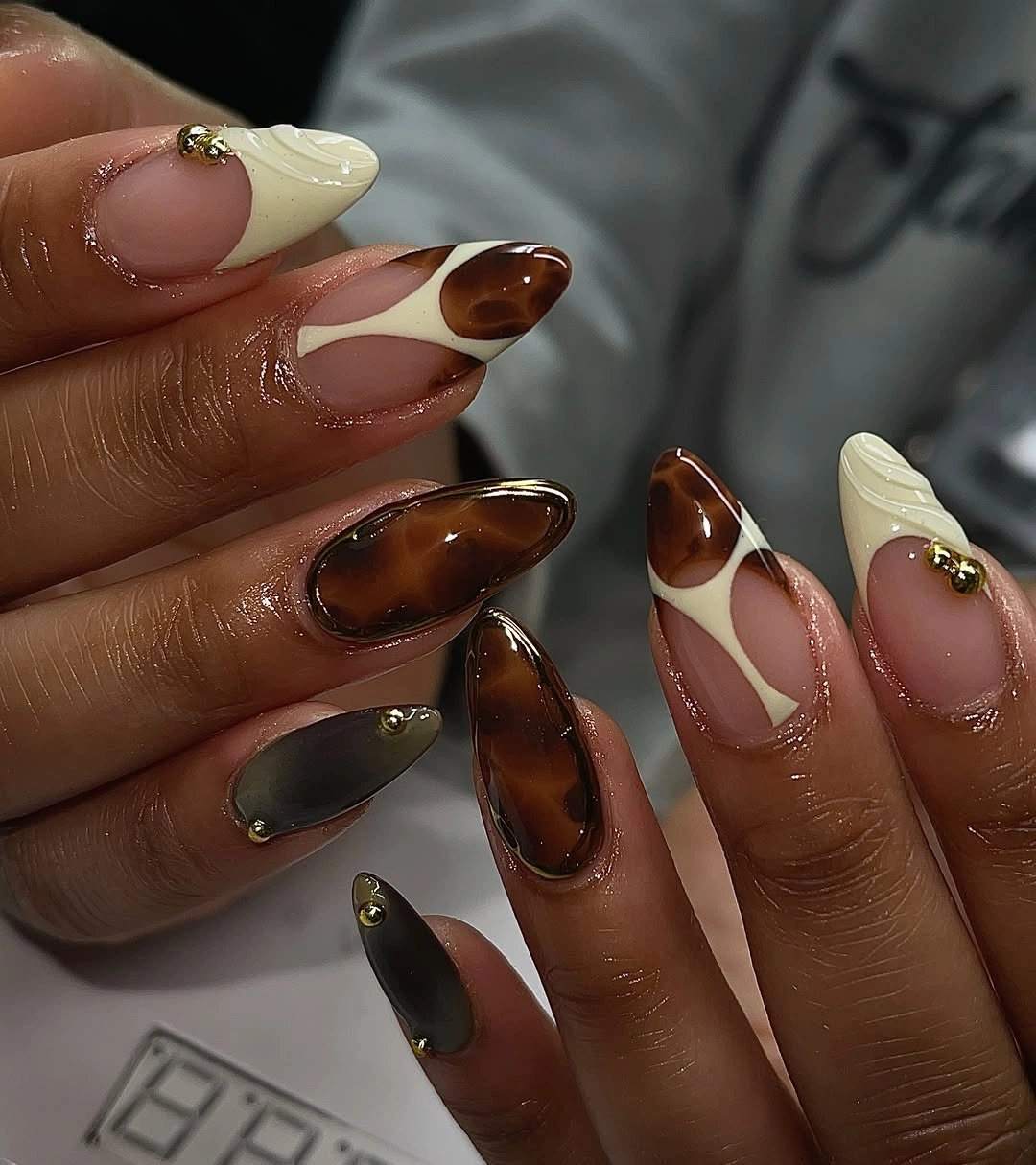 chic fall nail designs for all skin tones 2026 Glossy Tortoiseshell Meets Soft Vanilla Elegance