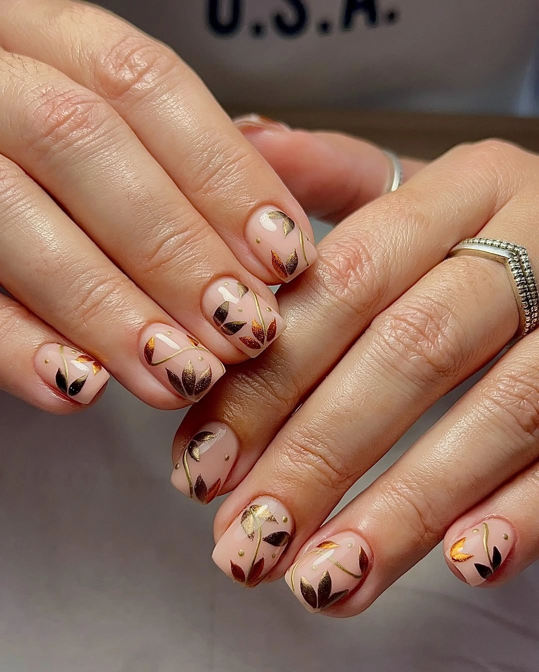 chic fall nail designs for all skin tones 2026 Golden Botanical Nails for a Soft Autumn Glow