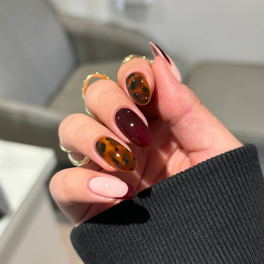 chic fall nail designs for all skin tones 2026 Burgundy French Tips Meet Tortoiseshell Chic