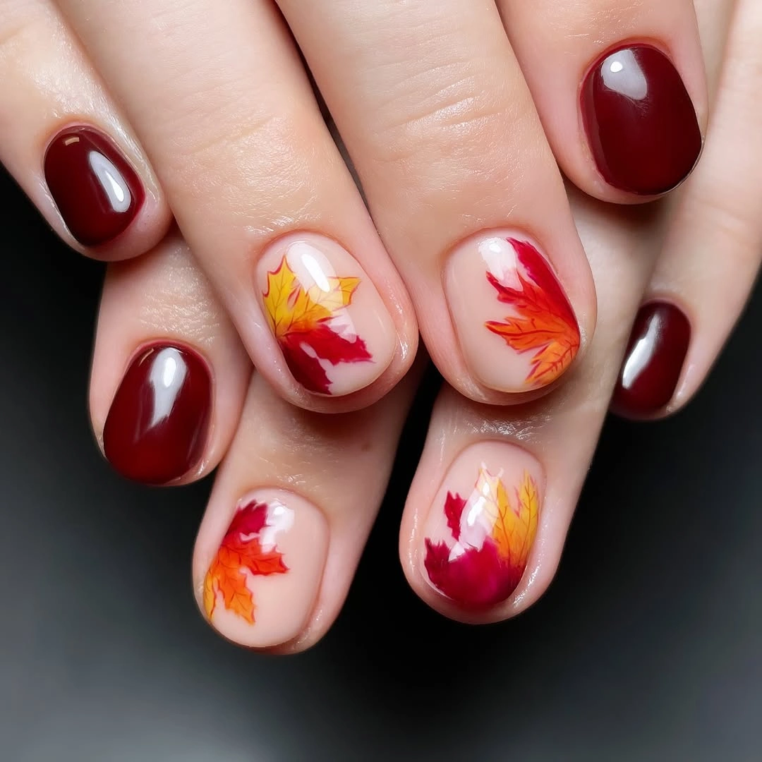 chic fall nail designs for all skin tones 2026 Classic Burgundy Nails with Vibrant Maple Leaf Art