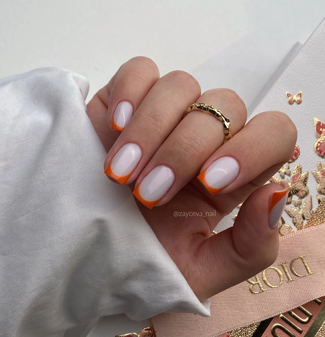 chic fall nail designs for office 2026 Soft Milky Nails with Burnt Orange French Tips