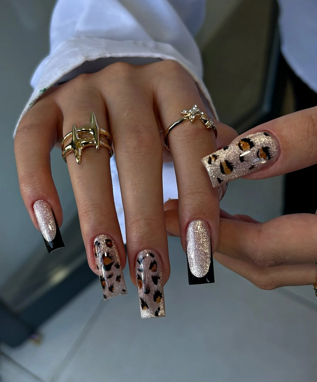 chic fall nail designs for office 2026 Champagne Leopard with Glossy Black Tips