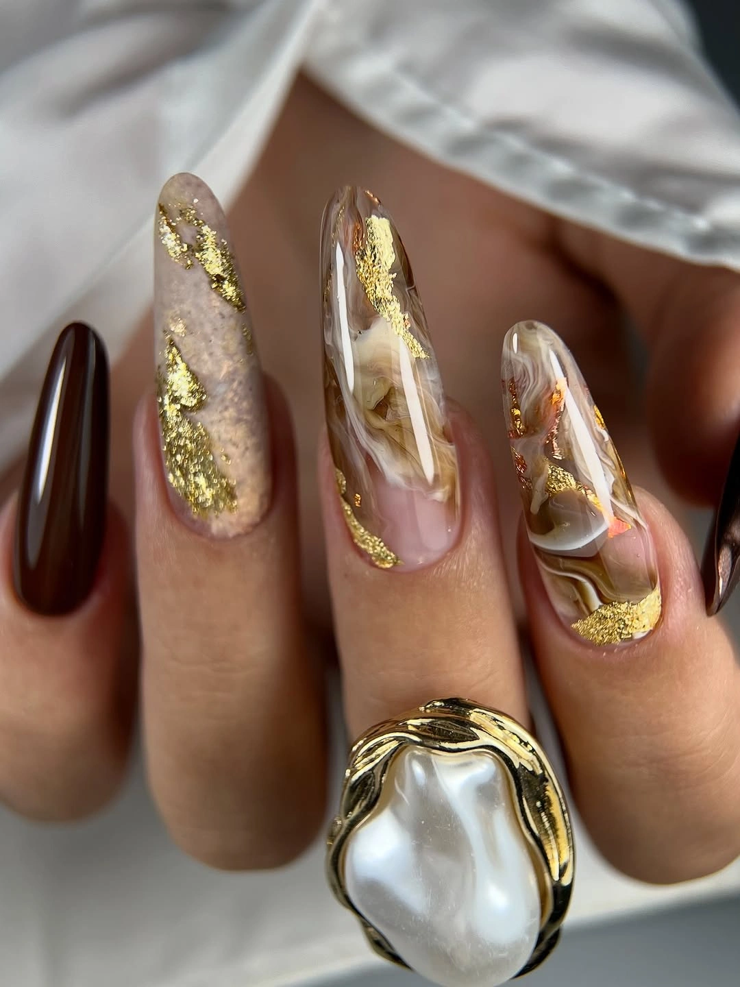 chic fall nail inspiration 2026 Golden Marble Almond Elegance