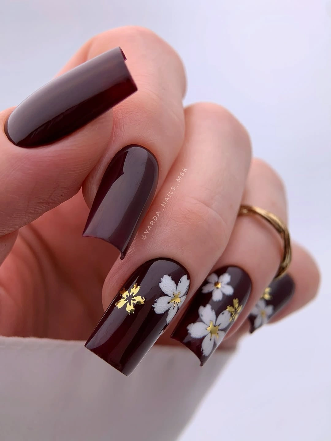chic fall nail inspiration 2026 Deep Burgundy Florals with Golden Highlights