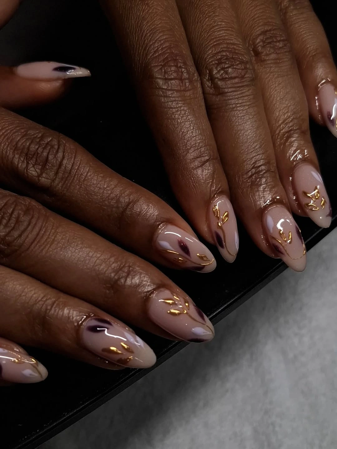 chic fall nails for brown skin tone Glossy Mocha Botanicals With Gold Details