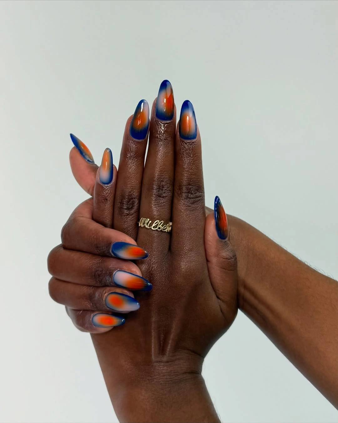 chic fall nails for brown skin tone Burnt Orange And Cobalt Aura Nails