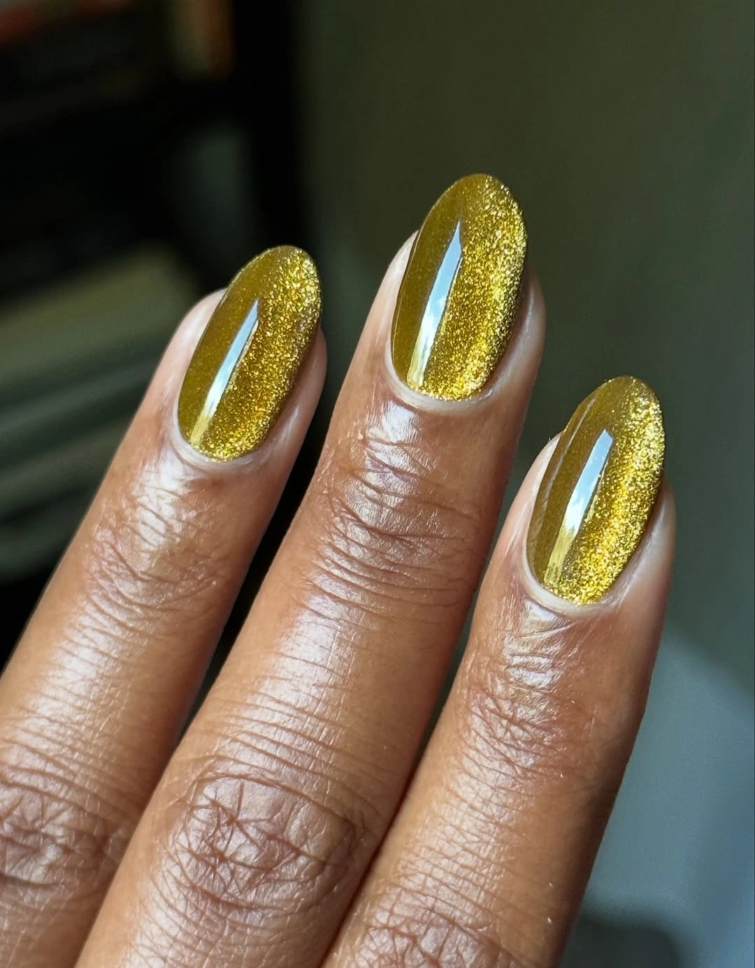 chic fall nails for brown skin tone Golden Olive Cat Eye For A Rich Autumn Glow