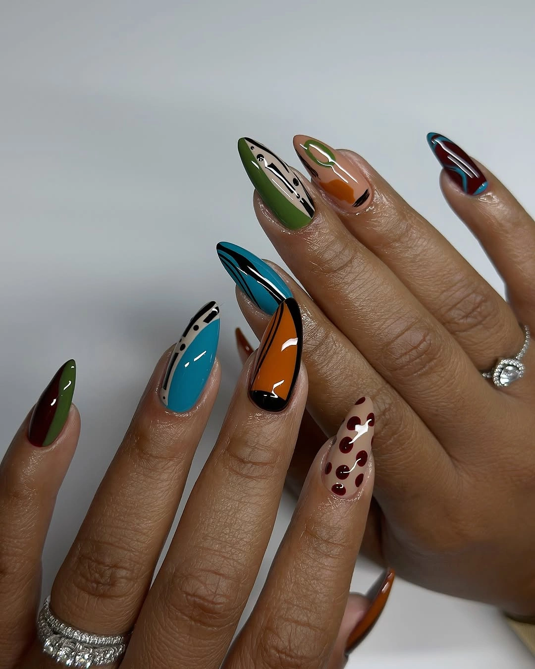 chic fall nails for brown skin tone Jewel Tone Abstract Nails For A Bold Fall Mood
