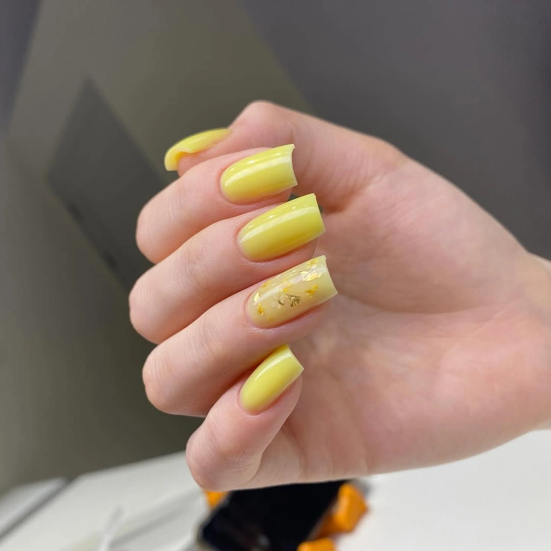 chic fall nails for pale skin 2026 Sunny Yellow with Gold Foil
